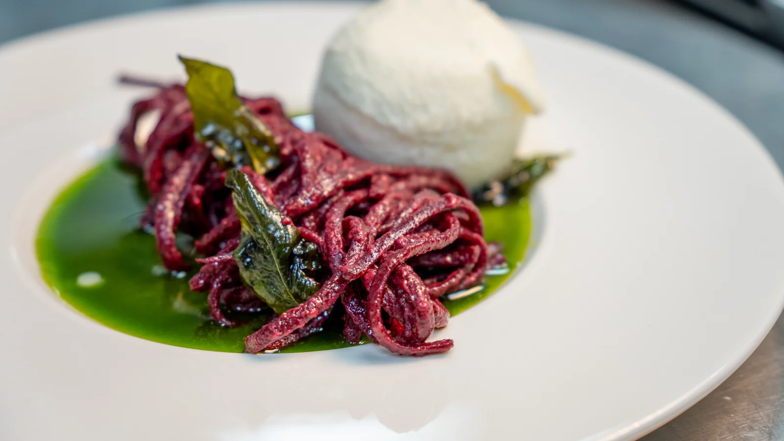 Beet linguine with burrata, close-up